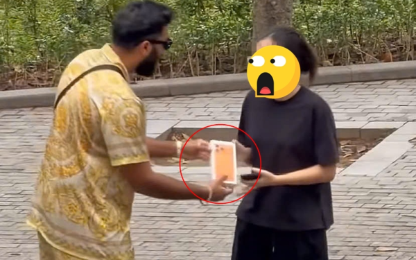 TikToker 9 triệu fan bị nghi dàn dựng video tặng iPhone cho cô gái người Việt, dân mạng phẫn nộ
