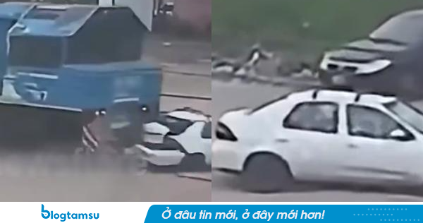Ô tô chết máy mắc kẹt trên đường ray bị đoàn tàu đâm trúng